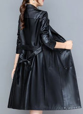 Short, elegant, double-breasted women's coat with a belt 0