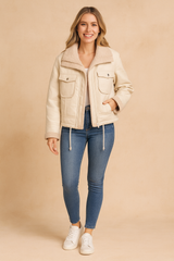 Cream faux leather shearling jacket for women featuring soft inner lining, flap front pockets, and zip closure — designed for warmth, style, and modern elegance.