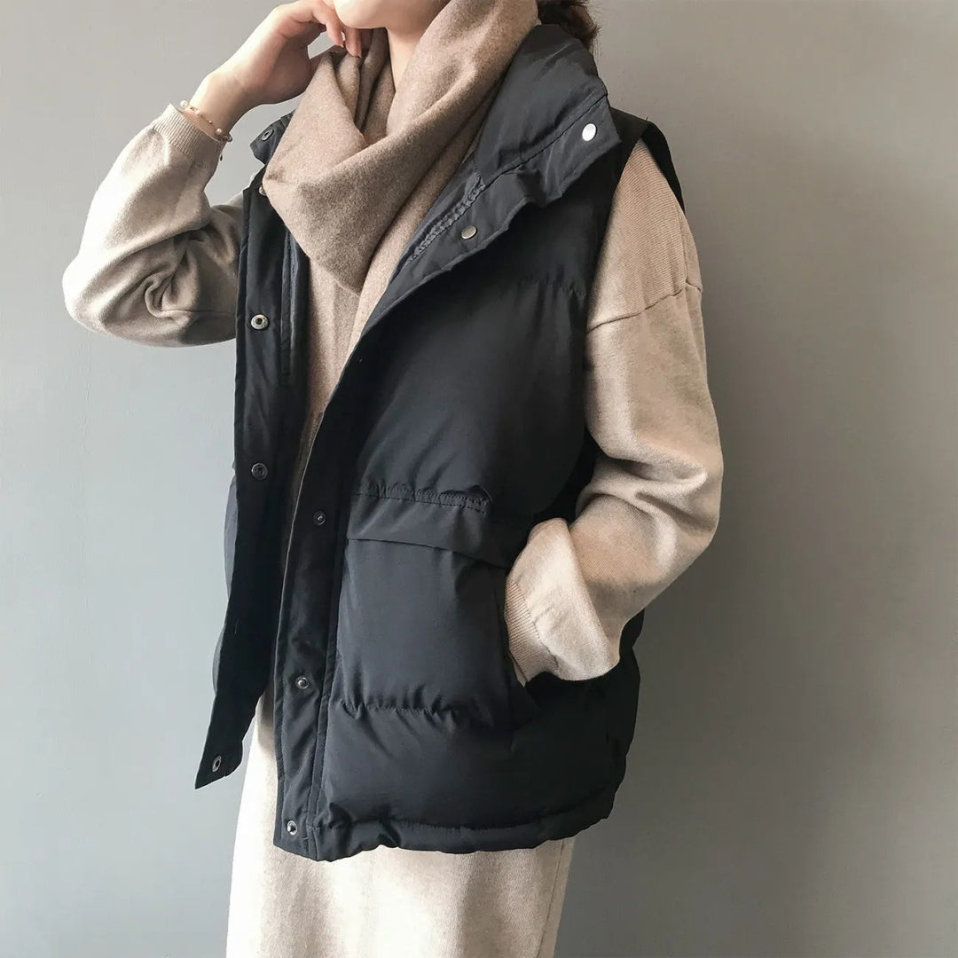 Women's quilted winter vest with pockets and snaps