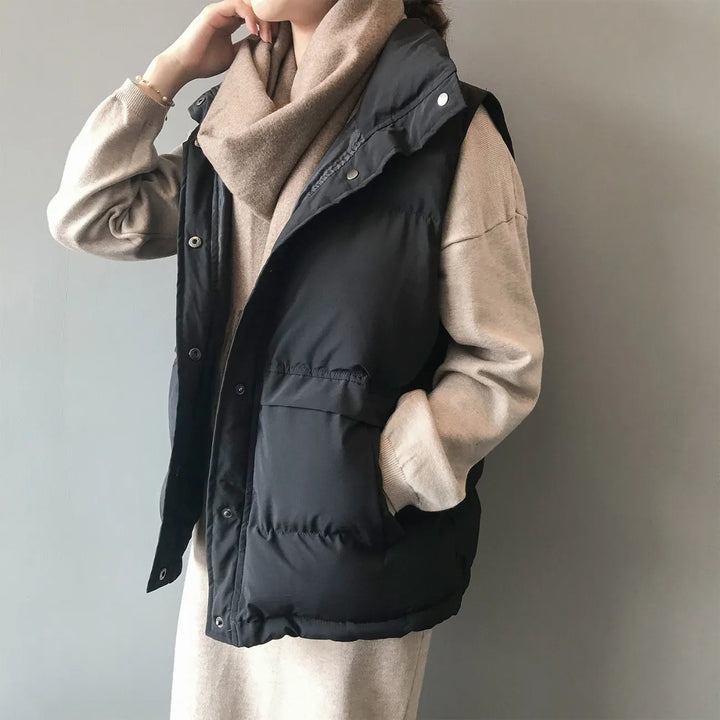 Women's quilted winter vest with pockets and snaps