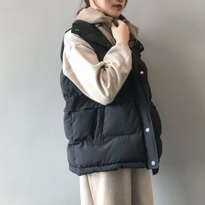Women's quilted winter vest with pockets and snaps