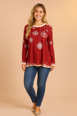 Women's festive red Christmas sweater with white snowflake prints, long sleeves, and a relaxed fit — perfect for cozy winter wear or holiday gatherings.